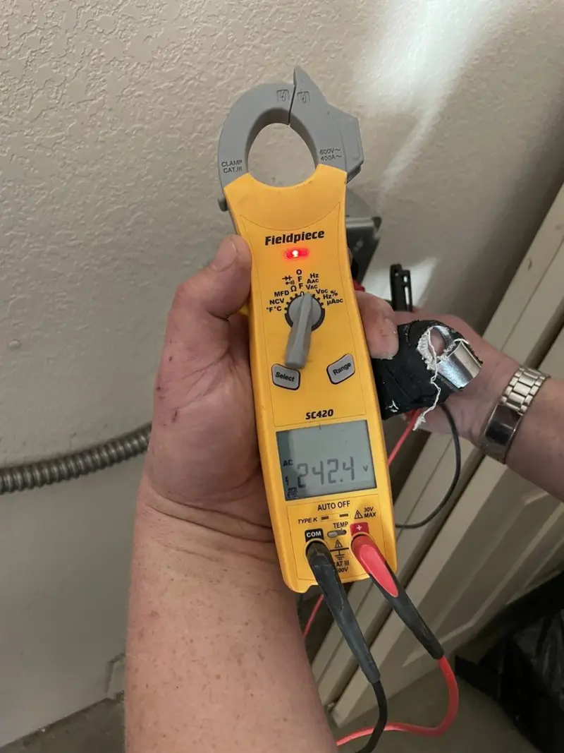 Voltage testing with clamp meter during Recessed Lighting Installation in Creve Coeur